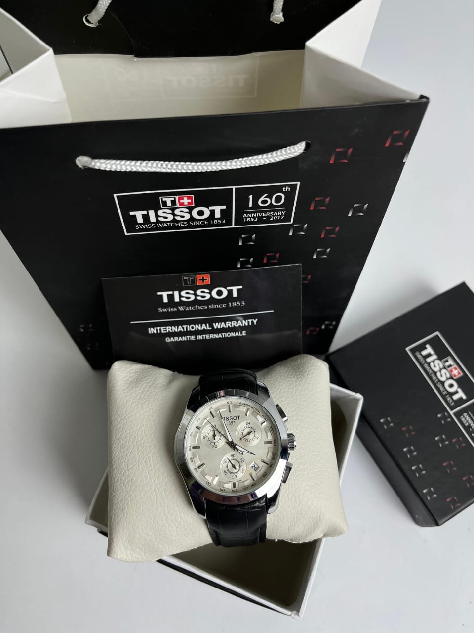 Tissot – Black Leather Strap, White Dial
